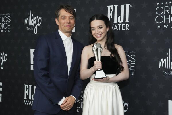 Sean Baker, left, and Mikey Madison, winners of the award for best picture for "Anora," pose in the press room during the 30th Critics Choice Awards on Friday, Feb. 7, 2025, at the Barker Hangar in Santa Monica, Calif. (Photo by Jordan Strauss/Invision/AP)