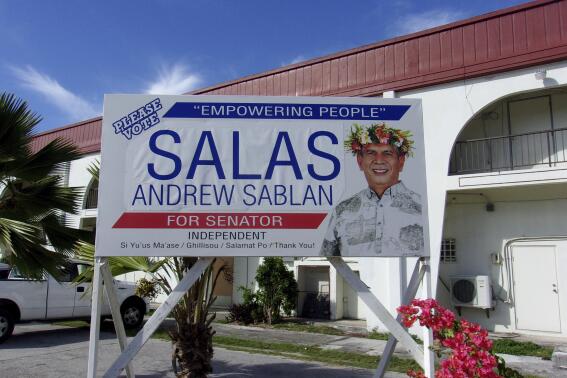 In this photo provided by Joseph Honey, a campaign sign for Andrew Sablan Salas is seen in Saipan, Northern Mariana Islands on Friday, June 3, 2022. Salas has filed a lawsuit challenging a ban against cockfighting in U.S. territories. (Joseph Honey via AP)