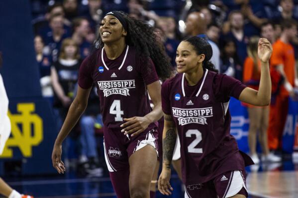 Mississippi State's Jessika Carter (4) and JerKaila Jordan (2) celebrate the team's win over Illinois in a First Four game in the NCAA women's college basketball tournament Wednesday, March 15, 2023, in South Bend, Ind. (AP Photo/Michael Caterina)
