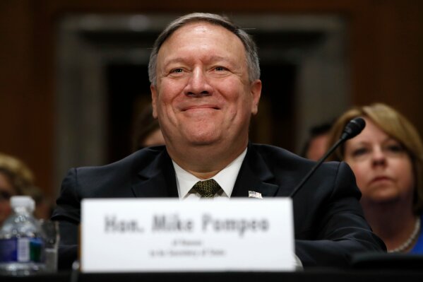 
              FILE - In this April 12, 2018, file photo Mike Pompeo smiles after his introduction before the Senate Foreign Relations Committee during a confirmation for him to become the next Secretary of State on Capitol Hill in Washington. (AP Photo/Jacquelyn Martin, File)
            