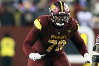 FILE -Washington Commanders offensive tackle Cornelius Lucas (78) blocks during an NFL football game against the New York Giants, Sunday, Dec. 12, 2022 in Landover, Md. The Washington Commanders have re-signed offensive tackle Cornelius Lucas to a one-year contract worth up to $4 million, according to a person familiar with the deal. The person spoke to The Associated Press on condition of anonymity Tuesday, March 19, 2024, because the agreement had not been announced.(AP Photo/Daniel Kucin Jr., File)