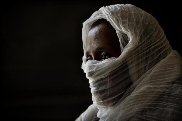 A 40-year-old woman who was says she was held captive and repeatedly raped by 15 Eritrean soldiers over a period of a week in a remote village near the Eritrea border, speaks during an interview at a hospital in Mekele, in the Tigray region of northern Ethiopia, on Friday, May 14, 2021. "They talked to each other. Some of them: 'We kill her.' Some of them: 'No, no. Rape is enough for her,'" she recalls. She said one of the soldiers told her: "This season is our season, not your season. This is the time for us." (AP Photo/Ben Curtis)
