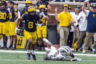 Michigan wide receiver Ronnie Bell (8) beats Western Michigan safety Delano Ware (26) to a reception and rushes in for a touchdown in the second quarter of an NCAA college football game in Ann Arbor, Mich., Saturday, Sept. 4, 2021. (AP Photo/Tony Ding)