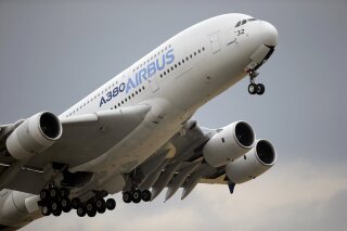 FILE - In this June 18, 2015, file photo, an Airbus A380 takes off for its demonstration flight at the Paris Air Show in Le Bourget airport, north of Paris. A World Trade Organization panel ruled Monday, Dec. 2, 2019, that the European Union has not complied with an order to end illegal subsidies for plane-maker Airbus, which prompted the Trump administration to impose tariffs on nearly $7.5 billion worth of EU goods in October. (AP Photo/Francois Mori, File)