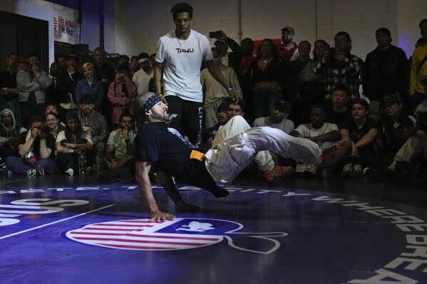 Miguel Rosario competes against Tahu during the semifinals in the Breaking for Gold Big Apple breakdancing regional competition Saturday, April 22, 2023, in the Brooklyn borough of New York. The hip-hop dance form makes its official debut at the Paris Games in 2024. (AP Photo/Frank Franklin II)