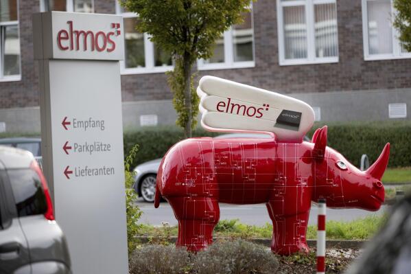 A winged 'Elmos rhinoceros' stands in front of the chip factory Elmos Semiconductor SE offices in Dortmund, Germany, Tuesday, Nov. 8, 2022. Germany company Elmos said it had been informed by the Economy Ministry that the sale of its factory in Dortmund to Silex Microsystems AB 'will most likely be prohibited' by the German Government. (Dieter Menne/dpa via AP)