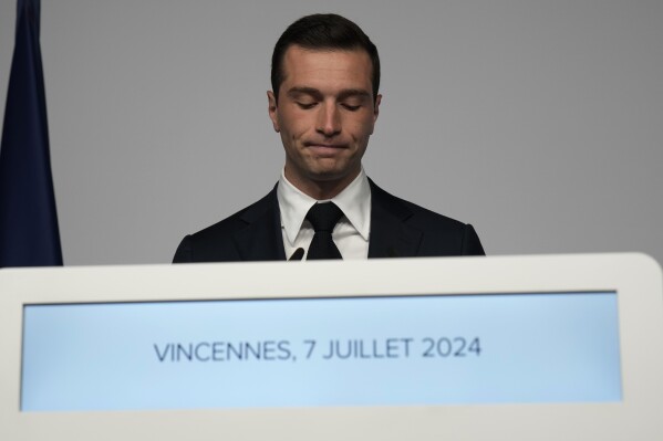 Far-correct National Rally celebration president Jordan Bardella delivers a speech after the 2nd spherical of the legislative election, Sunday, July 7, 2024 on the celebration election evening headquarters in Paris. (AP Photo/Louise Delmotte)