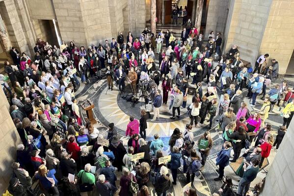 FILE - Hundreds of people crowded the Nebraska State Capitol Rotunda on Wednesday, Feb. 1, 2023, in Lincoln. Neb., to protest a so-called heartbeat bill that would outlaw abortion at a point before many women even know they're pregnant. North Dakota adopted a new abortion ban, while South Carolina and Nebraska lawmakers failed to and Washington and Minnesota protected abortion access. (AP Photo/Margery A. Beck, File)