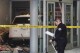 A police investigator surveys the scene of a vehicle crash at a Toyota Auto Dealership in the Mission Hills neighborhood of Los Angeles on Wednesday, Aug. 9, 2023. The vehicle driven by a customer entered the service area of dealership and struck a few people Wednesday. (AP Photo/Richard Vogel)