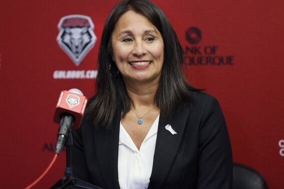 FILE - Gloria Nevarez, who has been named the next commissioner of the Mountain West, speaks during a news conference before an NCAA college basketball game between Air Force and New Mexico in Albuquerque, N.M., Jan. 27, 2023. A postseason football tournament involving only schools from outside the Power Four conferences could only work if it does not interfere with the 12-team College Football Playoff. Nevarez says she has seen the presentation that has been making the rounds among Group of Five administrators about a G5 playoff of sorts that would be funded by private equity. (AP Photo/Eric Draper, File)