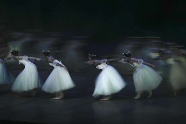 Ballet dancers perform "Giselle" during the annual presentation at the Teresa Carreno Theater in Caracas, Venezuela, Saturday, Sept. 16, 2023. (AP Photo/Matias Delacroix)
