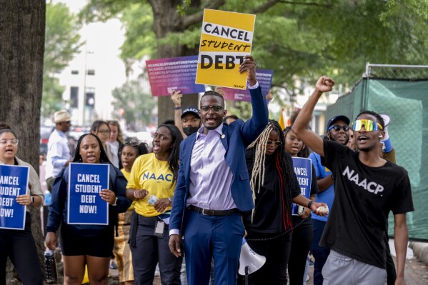 People demonstrate in Lafayette Park across from the White House in Washington, Friday, June 30, 2023, after a sharply divided Supreme Court has ruled that the Biden administration overstepped its authority in trying to cancel or reduce student loan debts for millions of Americans. Conservative justices were in the majority in Friday's 6-3 decision that effectively killed the $400 billion plan that President Joe Biden announced last year. (AP Photo/Andrew Harnik)