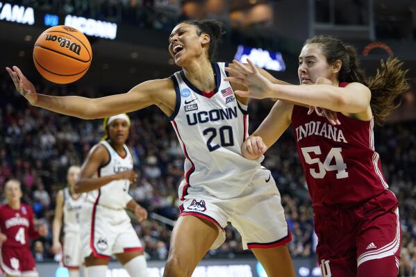 Connecticut forward Olivia Nelson-Ododa (20) reaches for a rebound against Indiana forward Mackenzie Holmes (54) during the fourth quarter of a college basketball game in the Sweet Sixteen round of the NCAA women's tournament, Saturday, March 26, 2022, in Bridgeport, Conn. (AP Photo/Frank Franklin II)