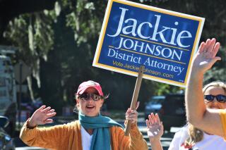 FILE - In this  Tuesday, Nov. 3, 2020 file photo, District Attorney Jackie Johnson campaigns for reelection on St. Simons Island, Ga. Johnson, a former Georgia prosecutor was indicted Thursday, Sept. 2, 2021 on misconduct charges alleging she used her position to shield the men who chased and killed Ahmaud Arbery from being charged with crimes immediately after the shootings. (Terry Dickson/The Brunswick News via AP, File)