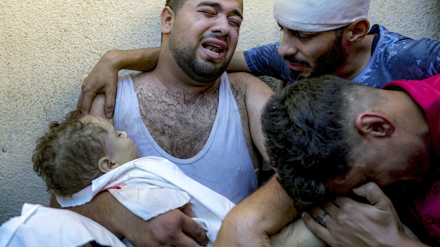 A Gaza father mourns his baby boy, killed in bed by an Israeli airstrike