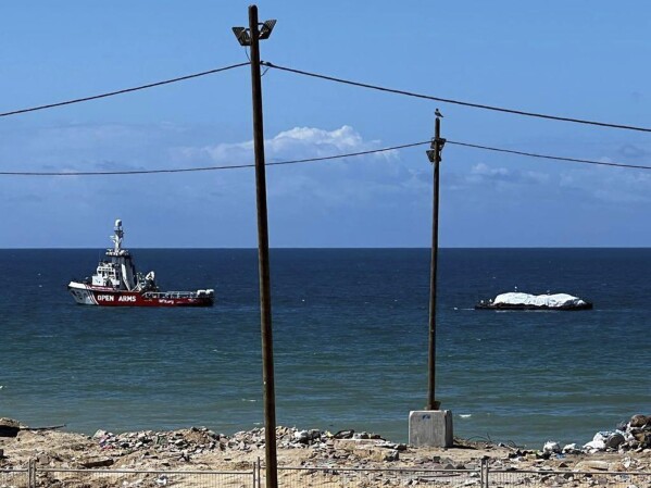 In this photo provided by the Israeli military, a ship carrying humanitarian aid from the World Central Kitchen (WCK), led by the United Arab Emirates, arrives in the maritime space of the Gaza Strip, Friday, March 15, 2024. (Israel Defense Forces via AP)