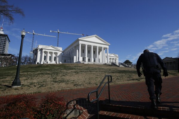 Police patrol around Capitol Square for the anticipated pro gun rally at the Virginia State Capit...