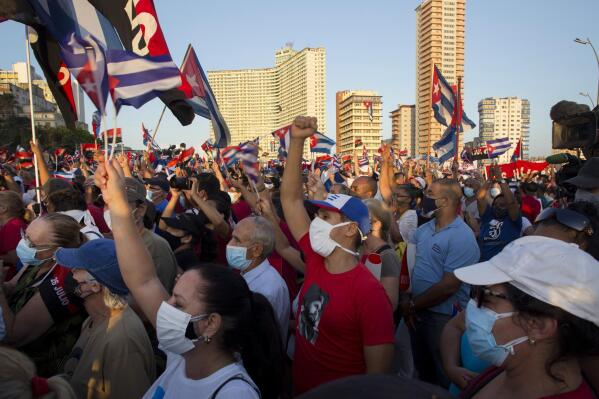 People attend a cultural-political event on the seaside Malecon Avenue with thousands of people in a show of support for the Cuban revolution six days after the uprising of anti-government protesters across the island, in Havana, Cuba, Saturday, July 17, 2021. (AP Photo / Ismael Francisco)