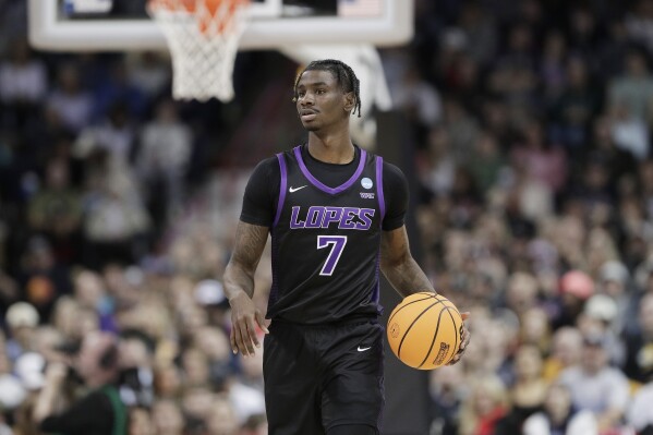 Grand Canyon guard Tyon Grant-Foster (7) controls the ball during the second half of a second-round college basketball game against Alabama in the NCAA Tournament in Spokane, Wash., Sunday, March 24, 2024. (AP Photo/Young Kwak, File)