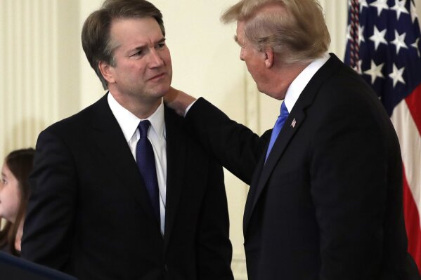
              President Donald Trump greets  Judge Brett Kavanaugh his Supreme Court nominee, in the East Room of the White House, Monday, July 9, 2018, in Washington.  (AP Photo/Evan Vucci)
            