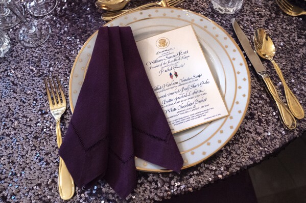 A place setting is seen atop a sequined tablecloth during a media preview, Wednesday, May 22, 2024, ahead of Thursday evening's State Dinner with Kenya's President William Ruto, at the White House in Washington. (AP Photo/Jacquelyn Martin)