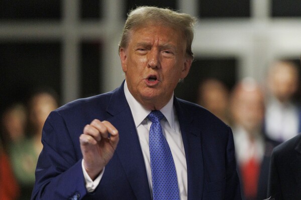 Former President Donald Trump speaks to the media after attending the day's proceedings at his hush money trial, in New York, Monday, May 20, 2024. (Sarah Yenesel/Pool Photo via AP)
