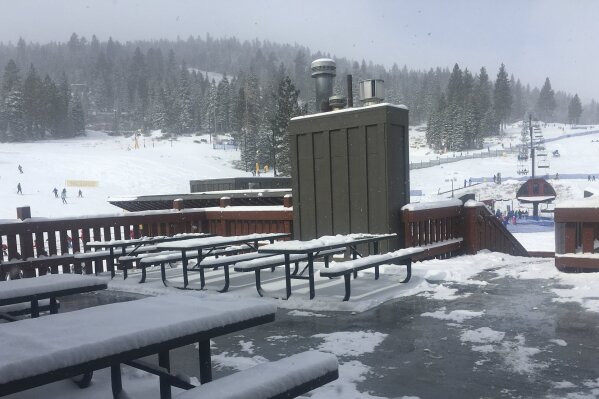 FILE - This Thursday, Feb. 22, 2018 file photo shows Northstar Ski Resort in Truckee, Calif.  After an expensive year-long legal battle with two season-pass holders,  free parking has returned to the resort. An 80-year-old attorney and another man whose first job out of college was parking cars at the mountain now owned by Vail Resorts filed separate lawsuits when Northstar California replaced traditional free parking with $20 daily fees ($40 weekends) after they'd purchased their passes. (AP Photo/Daisy Nguyen,File)