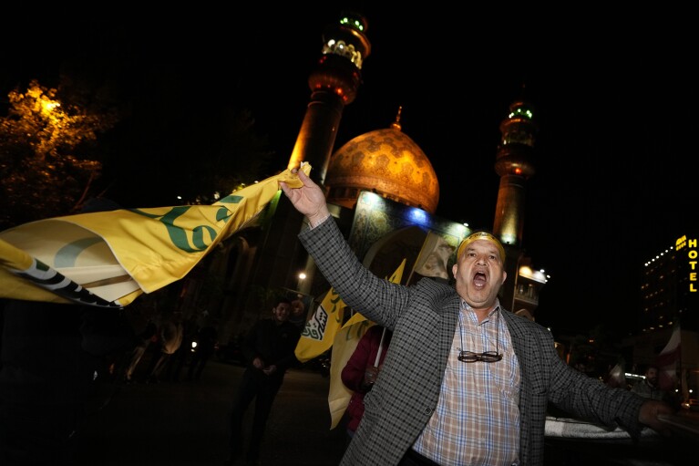 An Iranian demonstrator chants slogans while attending an anti-Israeli gathering at the Felestin (Palestine) Square in Tehran, Iran, early Sunday, April 14, 2024. Iran launched its first direct military attack against Israel Saturday. The Israeli military says Iran fired more than 100 bomb-carrying drones toward Israel. Hours later, Iran announced it had also launched much more destructive ballistic missiles. (AP Photo/Vahid Salemi)