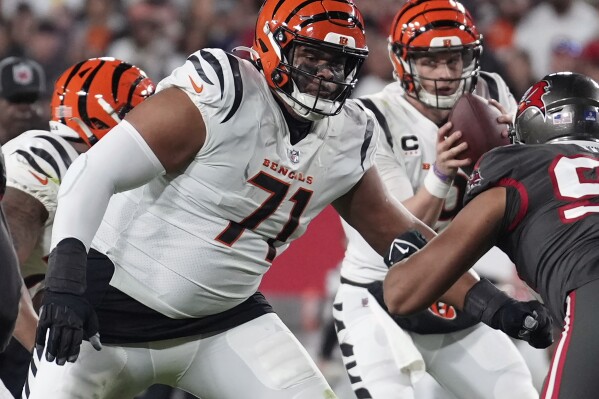 FILE - Cincinnati Bengals offensive tackle La'el Collins (71) blocks during an NFL football game against the Tampa Bay Buccaneers, Dec. 18, 2022, in Tampa, Fla. The Buffalo Bills have agreed to sign Collins to a one-year contract, the player's agent, Peter Schaffer confirmed in a text to The Associated Press, Thursday, April 4, 2024. (AP Photo/Peter Joneleit, File)