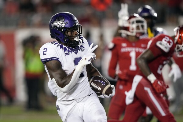 TCU running back Trey Sanders (2) celebrates after scoring a touchdown against Houston during the second half of an NCAA college football game Saturday, Sept. 16, 2023, in Houston. (AP Photo/David J. Phillip)