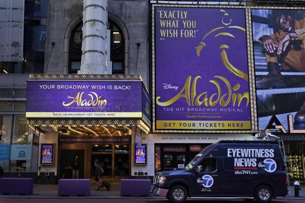 The marquee of the New Amsterdam theater appears in New York, Thursday, Sept. 30, 2021. The hit Broadway show "Aladdin" was canceled Wednesday night when breakthrough COVID-19 cases were reported within the musical's company, a day after the show reopened, a worrying sign for Broadway. (AP Photo/Seth Wenig)