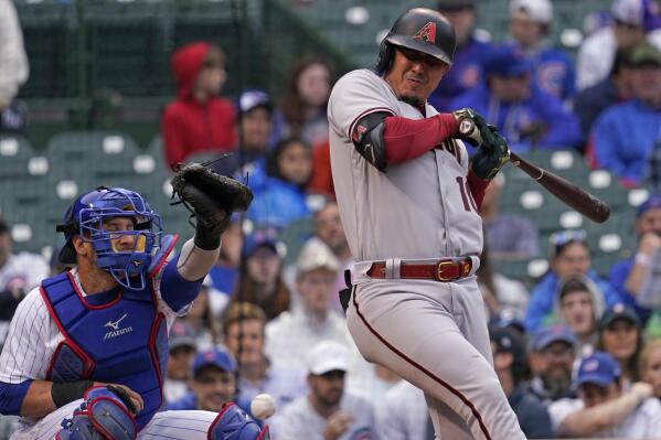 Arizona Diamondbacks' Josh Rojas reacts after striking out swinging during the first inning of a baseball game against the Chicago Cubs in Chicago, Saturday, May 21, 2022. (AP Photo/Nam Y. Huh)