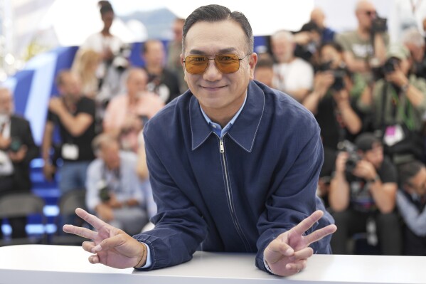 Huang Jue poses for photographers at the photo call for the film "Resurrection" at the 78th international film festival in Cannes, southern France, Friday, May 23, 2025. (AP Photo/Natacha Pisarenko)