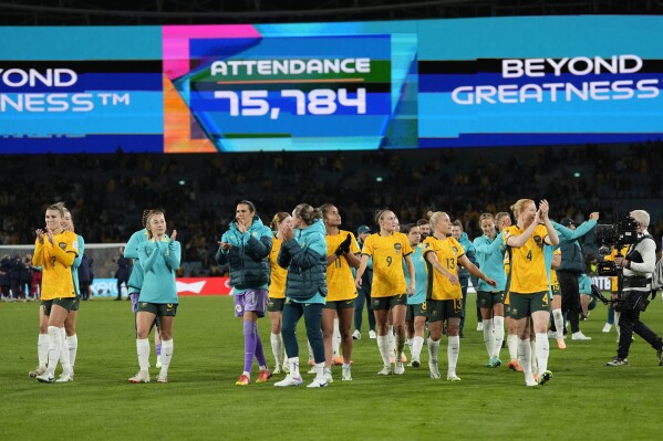 Australia's players leave the pitch after winning the Women's World Cup round of 16 soccer match between Australia and Denmark at Stadium Australia in Sydney, Australia, Monday, Aug. 7, 2023. (AP Photo/Rick Rycroft)