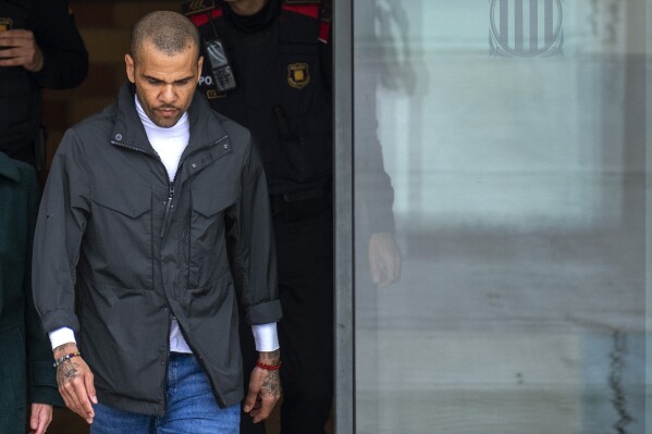 Brazilian soccer star Dani Alves leaves Brians 2 penitentiary center in Sant Esteve Sesrovires, near Barcelona, northeast, Spain, Monday, March 25, 2024. A Spanish court says Dani Alaves has deposited a bail of one million euros required for his release from prison and will also have to hand over his passports while appealing a rape conviction in Barcelona. (AP Photo/Emilio Morenatti)