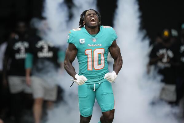 Miami Dolphins wide receiver Tyreek Hill (10) reacts as he is introduced before the first half of an NFL football game against the New York Jets, Sunday, Jan. 8, 2023, in Miami Gardens, Fla. (AP Photo/Rebecca Blackwell)