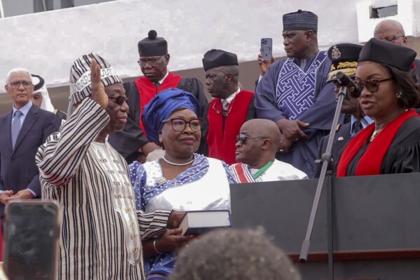 In this picture taken from video, Liberia's new President Joseph Nyuma Boakai, front left, is sworn into office in Monrovia, Liberia, Monday, Jan. 22, 2024, after a narrow win in the November elections to become the country's oldest-ever president. The 79-year-old Boakai has promised to unite and rescue Africa's oldest republic from its economic woes, ranging from chronic corruption to an ailing economy. (AP Photo)