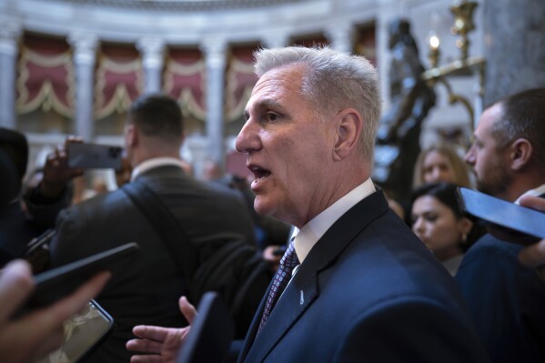 Speaker of the House Kevin McCarthy, R-Calif., stops for reporters' questions about passing a funding bill and avoiding a government shutdown, at the Capitol in Washington, Monday, Sept. 18, 2023. McCarthy is trying to win support from right-wing Republicans by including spending cuts and conservative proposals for border security and immigration. (AP Photo/J. Scott Applewhite)