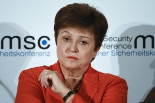 FILE - In this Feb. 14, 2020 file photo, Kristalina Georgieva, Managing Director of the International Monetary Fund, attends a session on the first day of the Munich Security Conference in Munich, Germany.   Georgieva said Friday, March 27,  it is clear that the global economy has now entered a recession that could be as bad or worse than the 2009 downturn.  She said the 189-nation lending agency was forecasting a recovery in 2021, saying it could be a “sizable rebound.” But she said this would only occur if nations succeed in containing the coronavirus and limiting the economic damage(AP Photo/Jens Meyer, File)