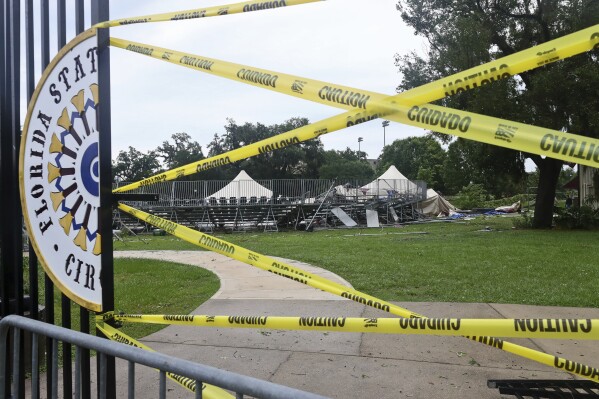 Caution tape blocks the path to Florida State University's Flying Circus bleachers that were damaged when the tent above them collapsed during strong weather in Tallahassee, Friday, May 10, 2024. Powerful storms bringing the threat of tornadoes continued to slam several southern states early Friday, as residents cleared debris from deadly severe weather that produced twisters in Michigan, Tennessee and other states. Some of the strongest storms early Friday rolled into Tallahassee. (AP Photo/Phil Sears)