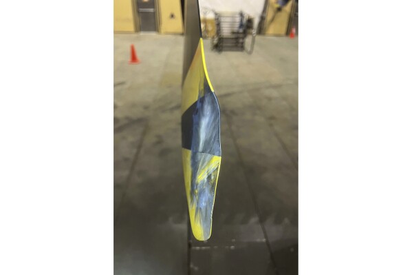 This image from video released by the U.S. Air Force, shows a damaged propeller from a U.S. drone, July 23, 2023. A Russian fighter jet flew within a few meters of a U.S. drone over Syria and fired flares at it, striking the American aircraft and damaging it, the U.S. military said Tuesday, the latest in a string of aggressive intercepts by Russia in the region. Despite the damage, the aircraft was able to return to its home base. (U.S. Air Force via AP)
