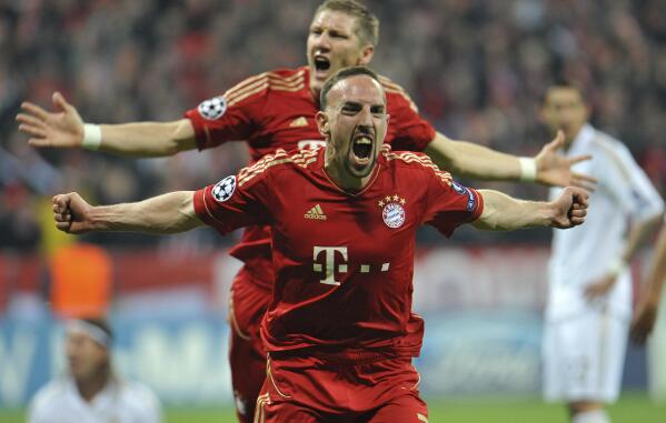 FILE - Bayern's Franck Ribery celebrates scoring the opening goal during the Champions League first leg semifinal soccer match between Bayern Munich and Real Madrid in Munich, southern Germany, on April 17, 2012. Former France winger Franck Ribéry ended his 22-year career on Friday, Oct. 21, 2022, because of insurmountable knee problems. The 39-year-old Ribéry, who played for France in the 2006 World Cup final and won the Champions League with Bayern Munich in 2013, announced the decision in a video posted on social media, where the Salernitana player also thanked his family and the fans. (AP Photo/Kerstin Joensson)