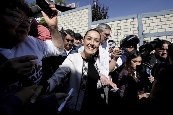 Ruling party presidential candidate Claudia Sheinbaum arrives to vote during general elections in Mexico City, Sunday, June 2, 2024. (AP Photo/Eduardo Verdugo)