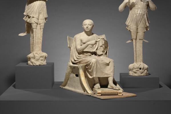 This undated photo provided by The J. Paul Getty Museum shows Sculptural Group of a Seated Poet and Sirens. The J. Paul Getty Museum in Los Angeles is returning ancient sculptures and other works of art that were illegally exported from Italy. The museum announced Thursday, Aug. 11, 2022, that next month it will ship back the nearly life-size group of statues known as "Orpheus and the Sirens." (The J. Paul Getty Museum via AP)