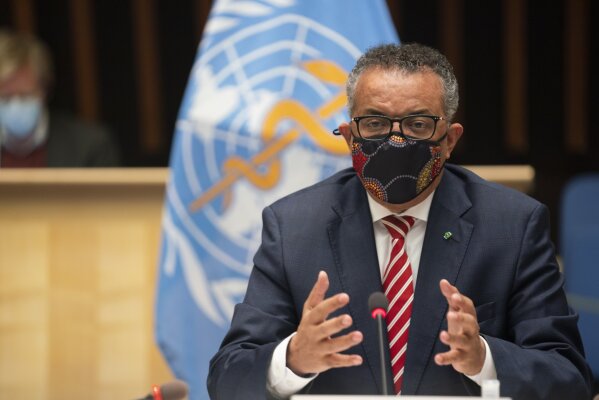 In this photo released by WHO, World Health Organisation on Monday, Oct. 5, 2020,  WHO Director-General, Dr Tedros Adhanom Ghebreyesus, wearing a mask to protect against coronavirus, gestures during a special session on the COVID-19 respnse. The head of emergencies at the World Health Organization says its “best estimates” indicate that roughly 1 in 10 people worldwide may have been infected by the coronavirus. (Christopher Black/WHO via AP)