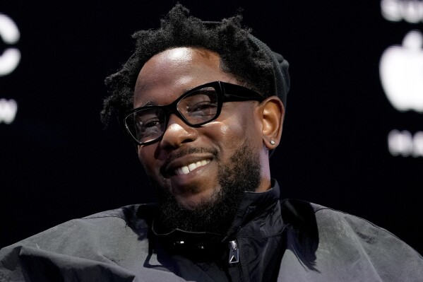 Apple Music Super Bowl LIX Halftime Show performer Kendrick Lamar smiles during a news conference, Thursday, Feb. 6, 2025, in New Orleans ahead of the NFL Super Bowl 59 football game between the Philadelphia Eagles and the Kansas City Chiefs. (AP Photo/Matt York)