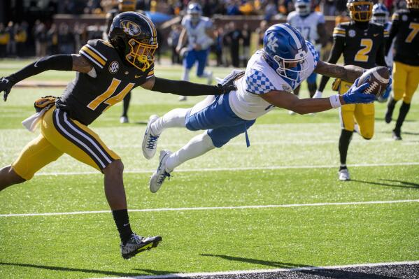 Kentucky wide receiver Dane Key, right, dives over the goal line for a touchdown in front of Missouri defensive back Kris Abrams-Draine, left, during the fourth quarter of an NCAA college football game Saturday, Nov. 5, 2022, in Columbia, Mo. (AP Photo/L.G. Patterson)