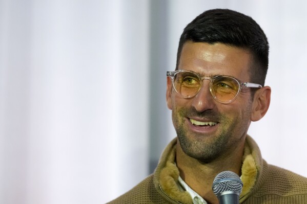 Serbian tennis player Novak Djokovic smiles during a press conference after the screening of the documentary film about Croatian tennis legend Niki Pilic, former tennis player and former trainer of Novak Djokovic, Boris Becker and Goran Ivanisevic, in Belgrade, Serbia, Thursday, March 28, 2024. Top-ranked Novak Djokovic has split with coach Goran Ivanisevic, ending their association that began in 2018 and included 12 Grand Slam titles for the Serbian tennis player. (AP Photo/Darko Vojinovic)