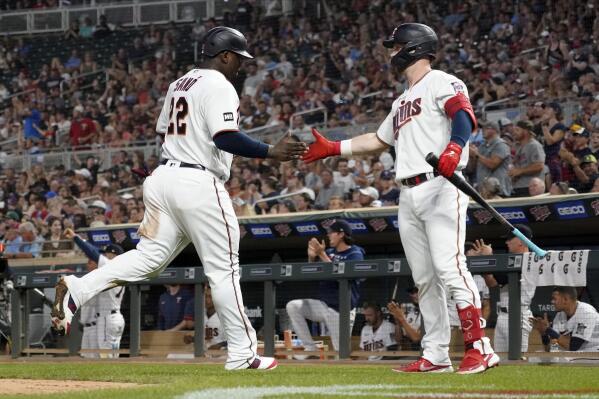 Minnesota Twins' Ryan Jeffers, right, congratulates Miguel Sano after Sano scored on a hit by Nick Gordon off Los Angeles Angels relief pitcher Steve Cishek during the sixth inning of a baseball game Friday, July 23, 2021, in Minneapolis. The Twins won 5-4. (AP Photo/Jim Mone)