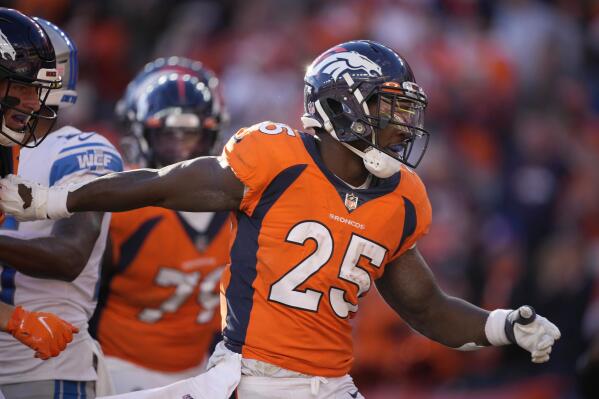 Denver Broncos running back Melvin Gordon III (25) is hit against